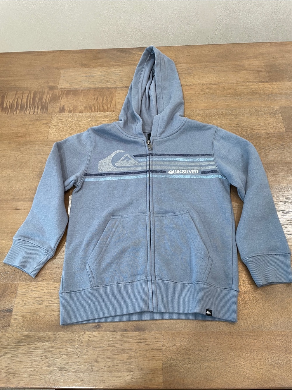 NWT Quiksilver Light Blue Kids Zip Hoodie with Striped Chest Logo. Size 6.